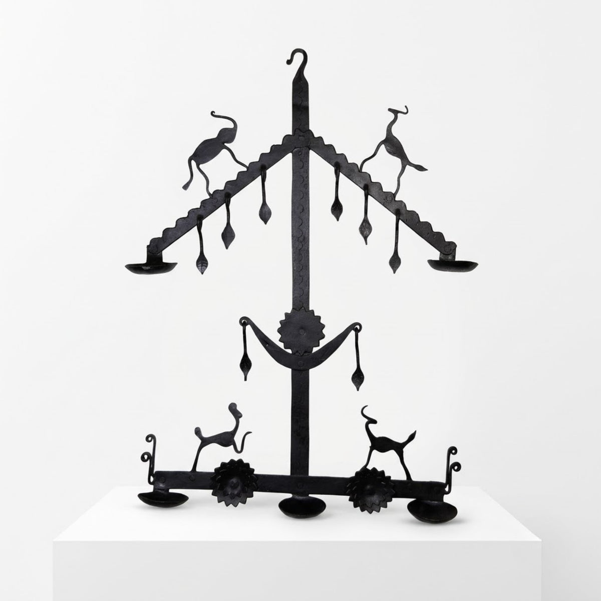 handcrafted bastar wrought iron tribal diya stand with horned deer & sun motifs