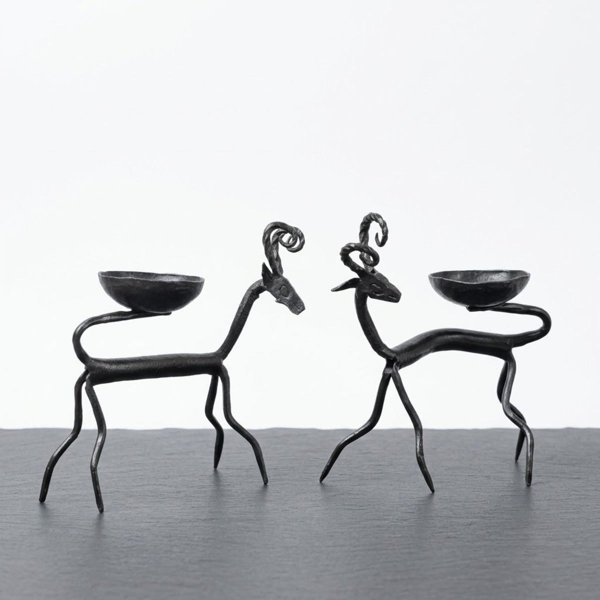 handcrafted bastar wrought iron spiral-horned antelope candle holders (pair)
