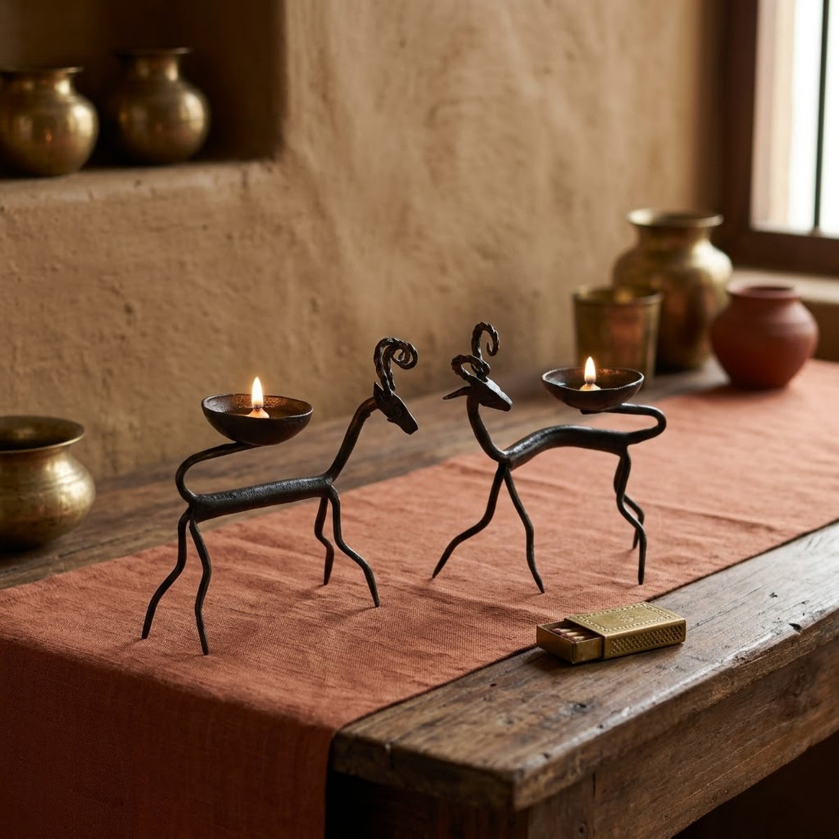 handcrafted bastar wrought iron spiral-horned antelope candle holders (pair)