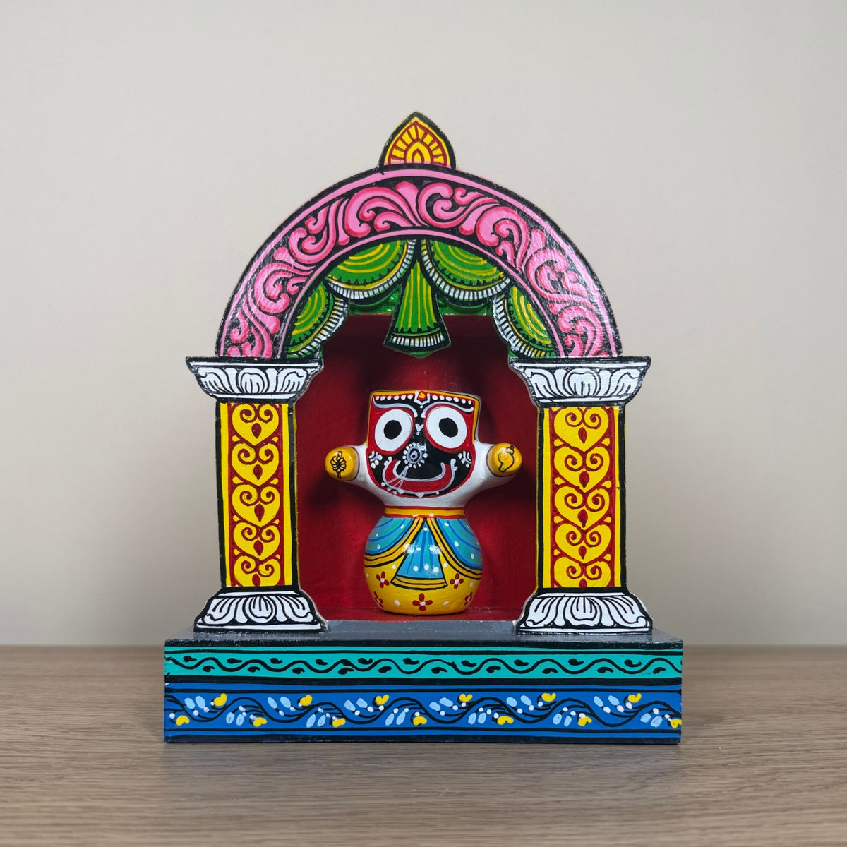 hand-painted wooden lord jagannath shrine with pink arch – traditional odisha pattachitra art