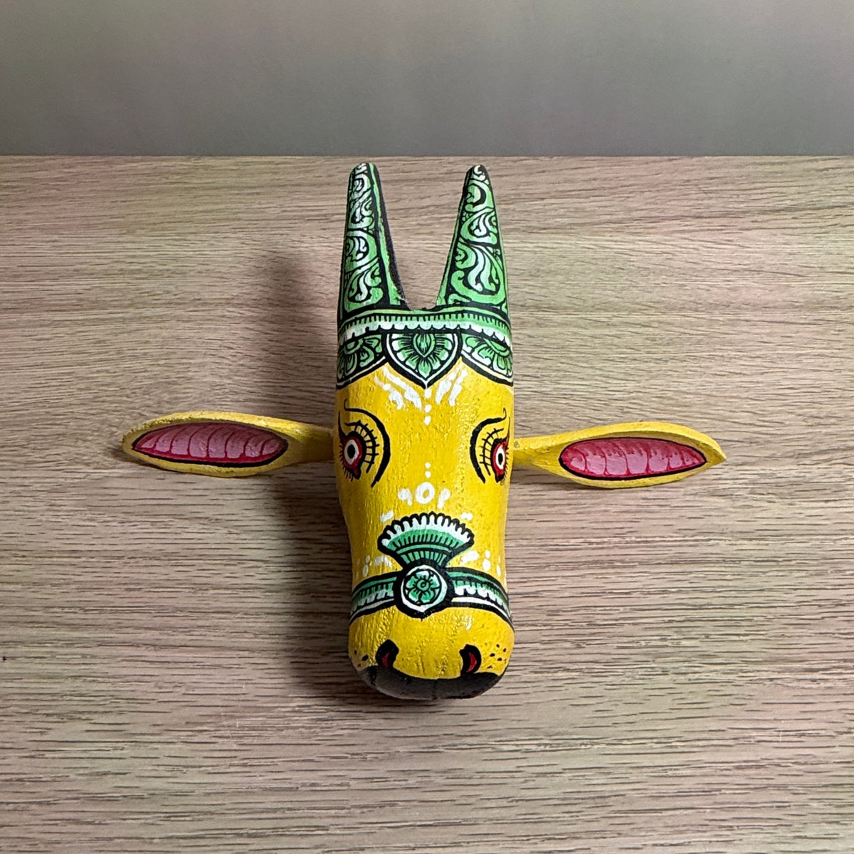 handcrafted wooden cow head wall hanging | traditional yellow & green odisha folk art accent