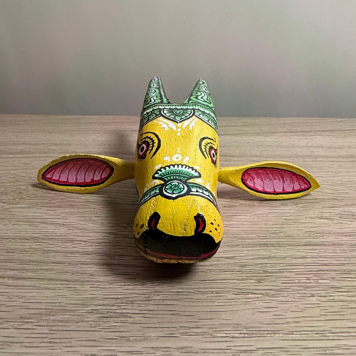 handcrafted wooden cow head wall hanging | traditional yellow & green odisha folk art accent