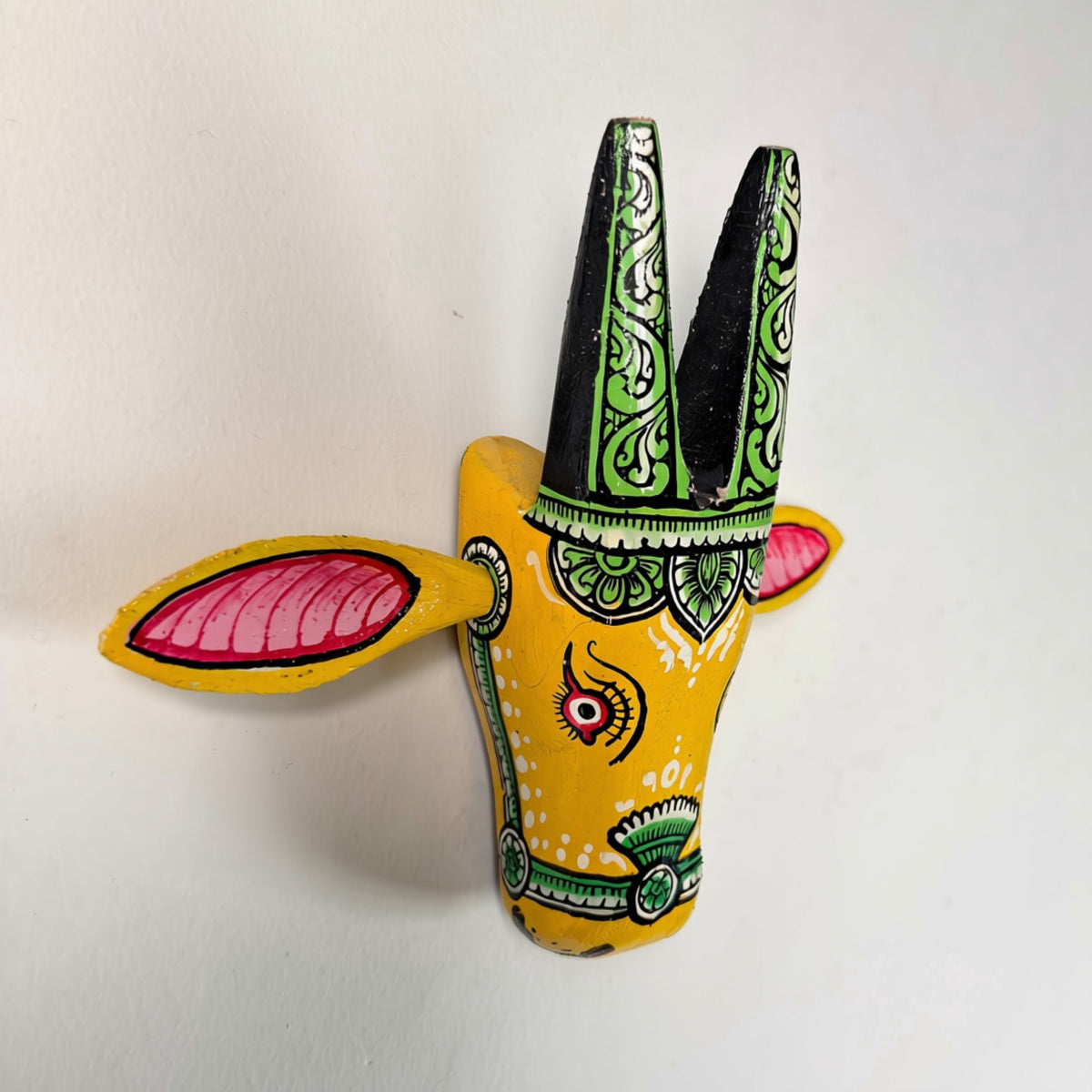 handcrafted wooden cow head wall hanging | traditional yellow & green odisha folk art accent