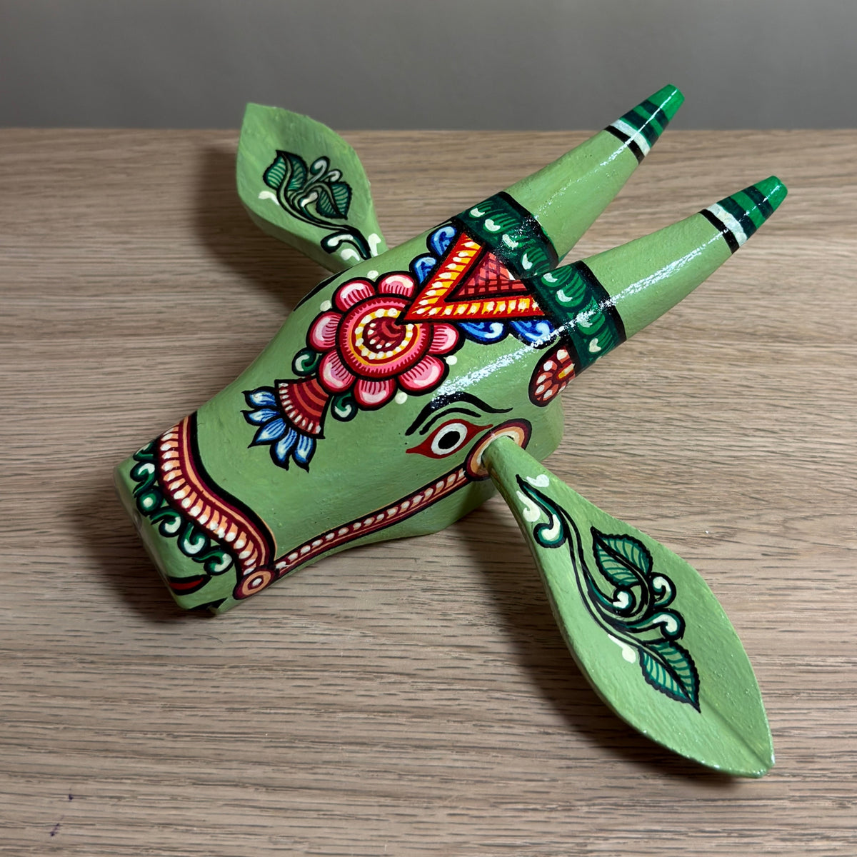 handcrafted wooden cow head wall hanging | olive green traditional odisha folk art accent